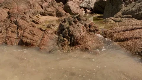 Waves breaking on the beach at St Brelade, Channel Islands. 스톡 동영상 226977950