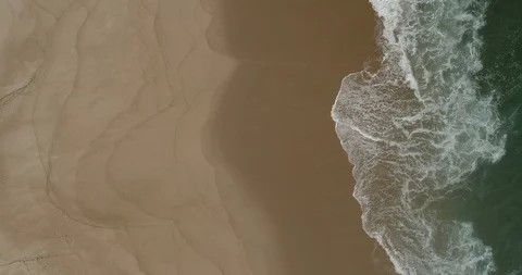 Waves breaking on the beach on a stormy day Stock Footage 104957212