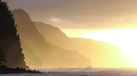 Waves Breaking on a Beach at Sunset Orange Gold Light Stock Footage 1046204