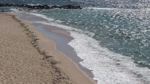 Waves breaking on beach of Vila do Conde, Portugal in slow motion Stock Footage 132223807