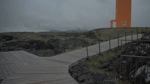 Waves breaking on the black rock cliff of western Icelandic coast, Svörtuloft Stock Footage 94154447