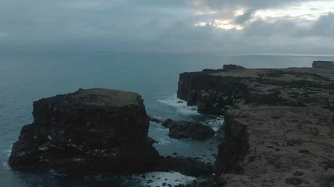 Waves breaking on the black rock cliff of western Icelandic coast, Snaefellsnes Stock Footage 98263317