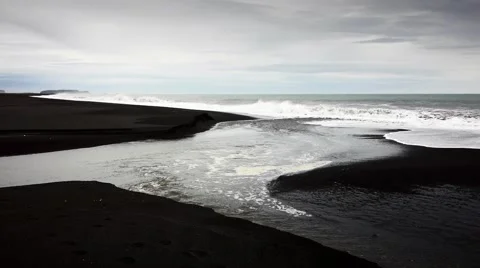 Waves Breaking onto the Black Sand Beach at Solheimasandur  Video stock 67854038