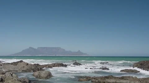 Waves Breaking on Blouberg Shore, Table Mountain Backdrop. Stock Footage 324635592