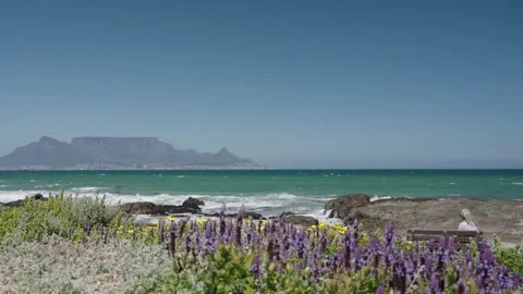 Waves Breaking on Blouberg Shore, Table Mountain Backdrop. Stock Footage 324642896