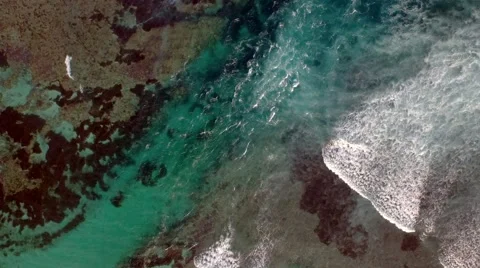Waves breaking in a channel between the reefs Stock Footage 61951402