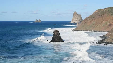 Waves breaking on the coast on a sunny day. Benijo beach in Tenerife. Video stock 173260778