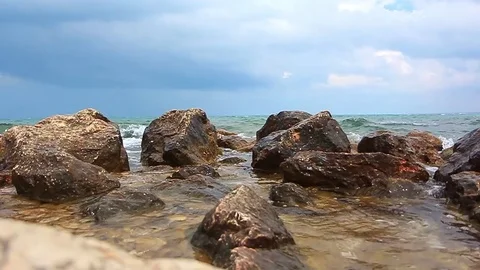 Waves breaking on coastal rocks Stock Footage 70863395