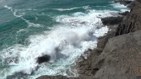 Waves breaking on dark lava rocks El Cotillo HD 1080 25p 16:9 Stock Footage 120089837