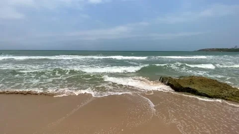 Waves breaking during vacation at the beach. Видео 238871315