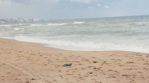 Waves breaking on the edge of sand cover cloudy sky Stock Footage 123622893
