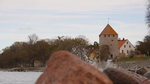 Waves breaking in front of the castle of Visby, Gotland, Sweden Stock Footage 101596911