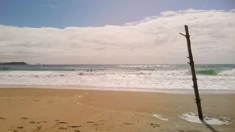 Waves breaking on golden sand Stock-Footage 127679753
