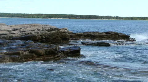 Waves breaking on granite ledges Stock Footage 449842