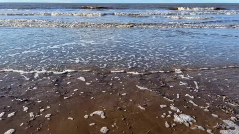 Waves breaking on incoming tide Stock-Footage 296778531