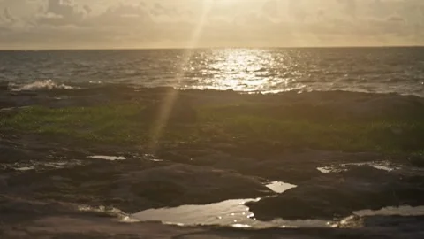 Waves Breaking onto Jagged Rocks Tropical Island Tide Pools Drone Sunrise Video stock 288038567