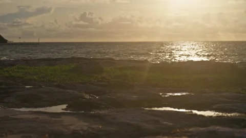 Waves Breaking onto Jagged Rocks Tropical Island Tide Pools Drone Sunrise Stock Footage 288038569
