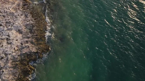 Waves Breaking onto Jagged Rocks Tropical Island Tide Pools Drone Stock Footage 288038598