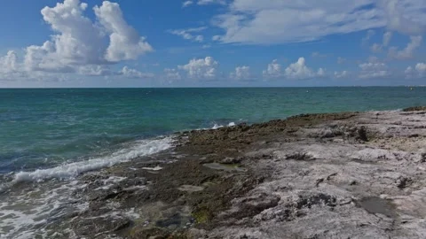 Waves Breaking onto Jagged Rocks Tropical Island Tide Pools Drone Stock Footage 288038610