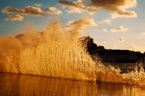 Waves breaking on the jetty Stock Photos
