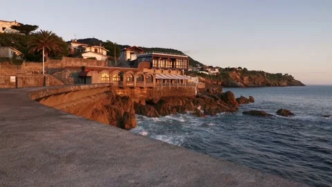 Waves breaking on the Lekeitio pier Stock Footage 133464451