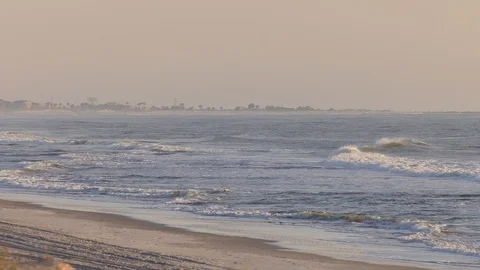 Waves breaking near sandy beach Stock Footage 93238816