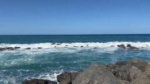 Waves breaking over coastal rock jetty near Castillo San Felipe del Morro Puerto Vídeos de archivo 346984917