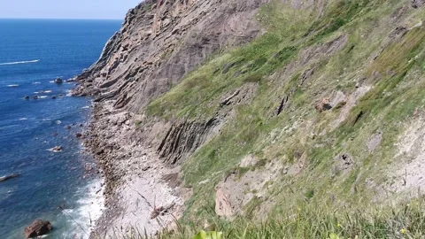 Waves breaking over a cove Stock Footage 130855239