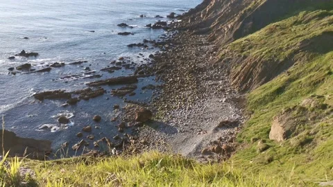 Waves breaking over a cove Video stock 130855327