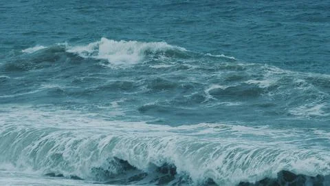 Waves Breaking Over Dangerous Beach Spray Wind Waves. Power Of Waves Breaking Stock Photos