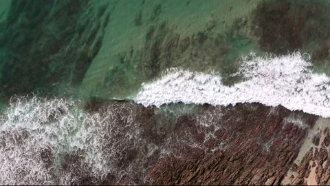 Waves breaking over reef in crystal clear water. Stock Footage 141373294