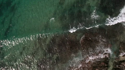 Waves breaking over reef in crystal clear water. Stock Footage 141373367