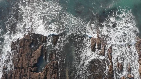 Waves breaking over rocks , nature Video stock 106425802