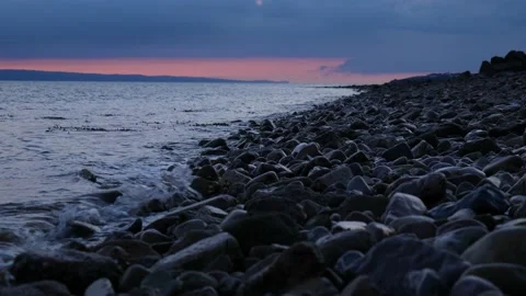 Waves Breaking Over Rocks At Sunset 4K Slow Motion Видео 212077575