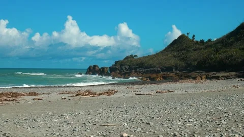 Waves breaking over rocky point Stock Footage 260370625