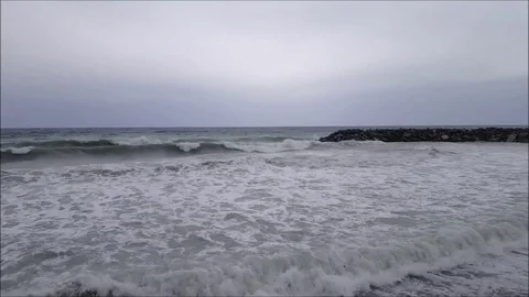 Waves breaking on an overcast day Stock Footage 81618202