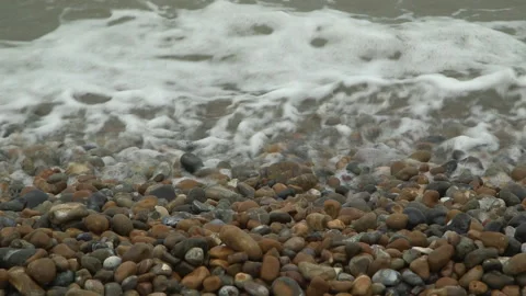 Waves Breaking On A Pebble Beach Close Up High Angle 스톡 동영상 144438469