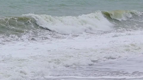 Waves breaking on a pebble beach during a low pressure area storm. Stock Footage 313526735