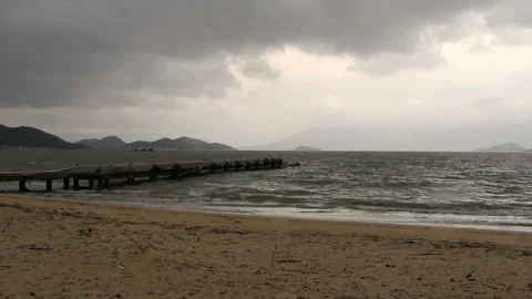 Waves breaking on a pier in windy weather Stock Footage 105117165