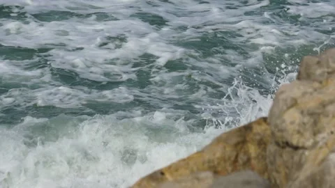 Waves breaking on port rocks Stock Footage 156865842