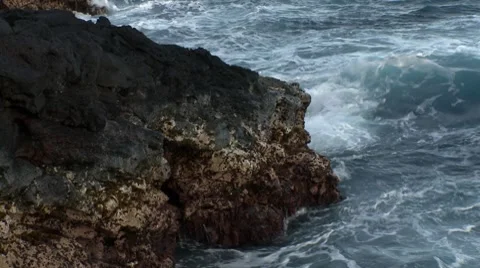 Waves breaking on a rock Stock Footage 8766553