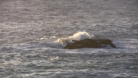 Waves breaking on rock Stock Footage 92869442