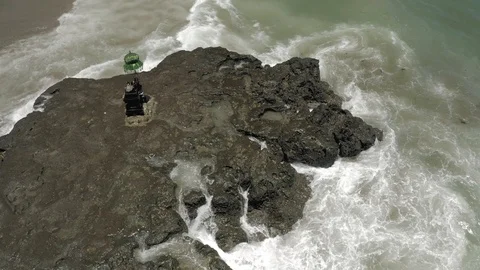 Waves breaking on the rocks Batu Balong beach Bali Island 4K Drone flight Stock Footage 119289988