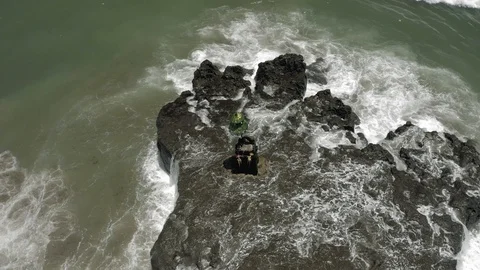 Waves breaking on the rocks Batu Balong beach Bali Island 4K Drone flight 스톡 동영상 119290124