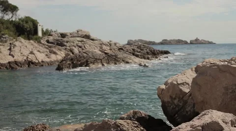 Waves breaking the rocks. Close up. Clean water. Stock Footage 54543837