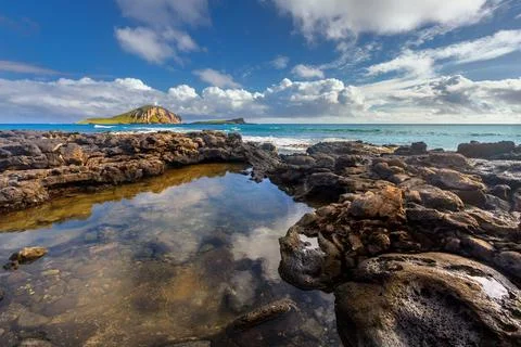 Waves breaking on rocks close to Macapuu beach, Oahu, Hawaii Stock Photos