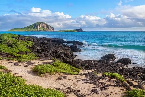 Waves breaking on rocks close to Macapuu beach, Oahu, Hawaii Stock Photos