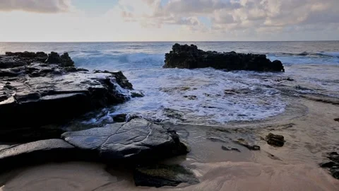 Waves breaking on rocks close to Sandy beach, Oahu, Hawaii Stock Footage 131965576