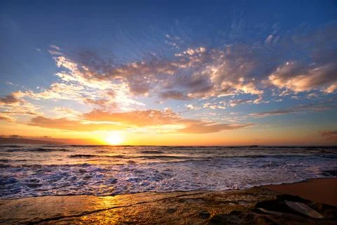 Waves breaking on rocks close to Sunset beach, Oahu, Hawaii Stock Photos