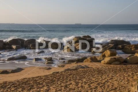 Waves Breaking on Rocks on Durban Shoreline Stock Photos